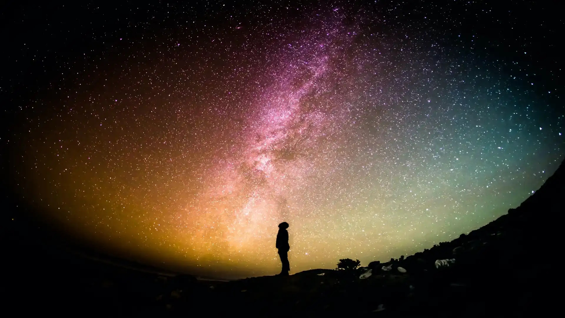 picture of stargazer looking at a galaxy